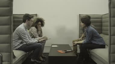 Men and women holding digital tablet and leaving after discussion in office