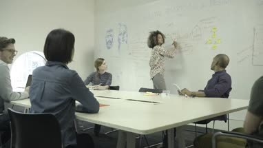 Men and women having meeting in conference room