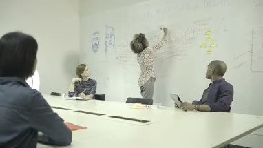 Men and women having meeting in conference room
