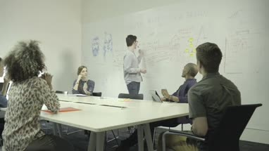 Men and women having meeting in conference room