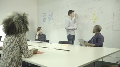Men and women having meeting in conference room
