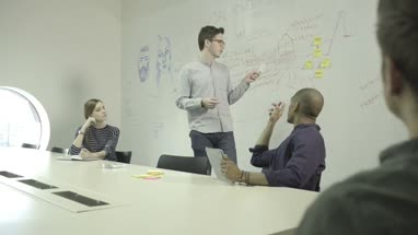 Men and women having meeting in conference room