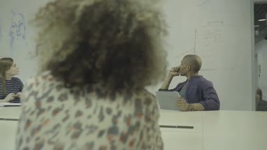 Men and women having meeting in conference room