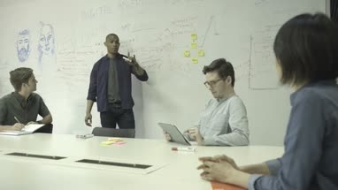 Men and women having meeting in conference room