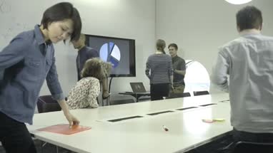 Men and women leaving conference room after the meeting