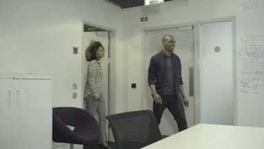 Men and women entering in conference room and starting the meeting