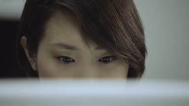Woman working on computer in office