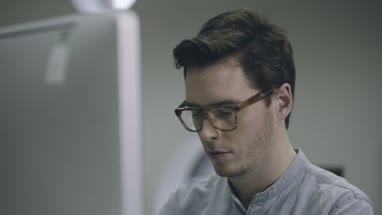 Young man working on computer in office