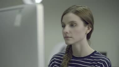 Young woman working on computer in office