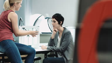 Team woman designers looking at 3D printed object