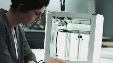 Team woman designers looking at 3D printed object