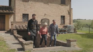 Senior couple on holiday visiting vineyard