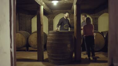Senior couple entering a wine cellar