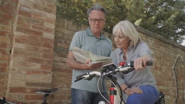 Senior couple planning bike tour