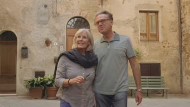 Senior tourists taking photo with smart phone