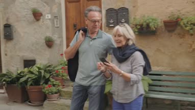 Senior tourists taking selfie with smart phone