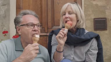 Senior couple enjoying icecream on holiday