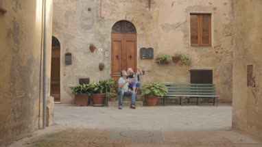 Senior couple enjoying icecream on holiday