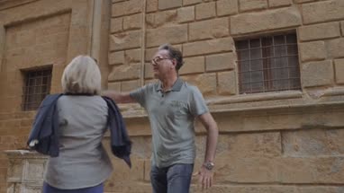 Senior couple dancing outdoors