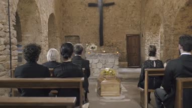 Mourners at funeral service in church