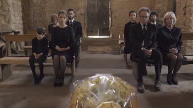 Mourners at funeral service in church