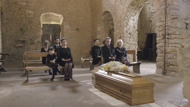 Mourners at funeral service in church