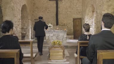 Mourners at funeral service in church