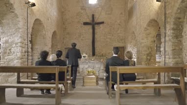 Mourners at funeral service in church