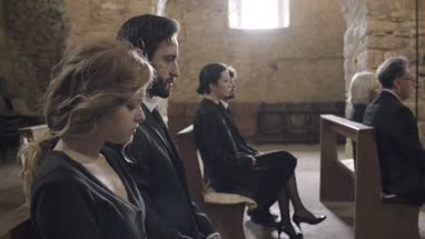 Senior Woman crying at a funeral