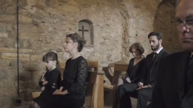 Senior Woman crying at a funeral