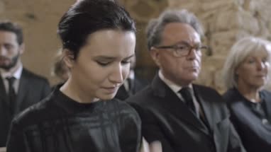 Mourners at funeral service