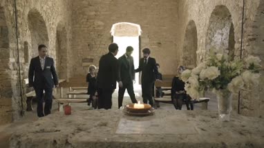 Pallbearers leaving Church with coffin followed by family