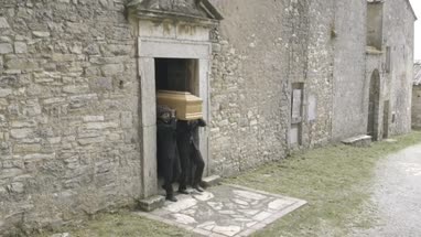 Pallbearers leaving with coffin
