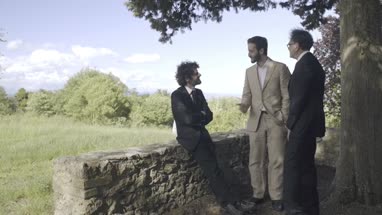 Father and adult sons talking