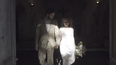 Family throwing confetti over bride and groom