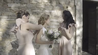 Bridesmaids chatting with Bride
