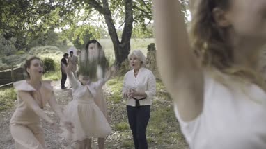 Bride throwing bouquet
