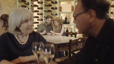 Couple looking at smart phone on a date