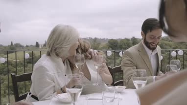 Mother congratulating daughter on wedding day