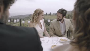 Bridesmaid giving Bride a gift