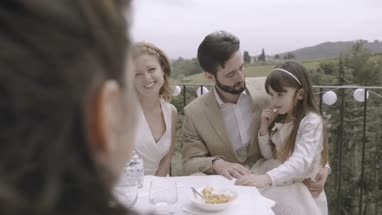 Bridesmaid giving Bride a gift