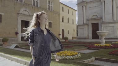 Young Adult walking through piazza