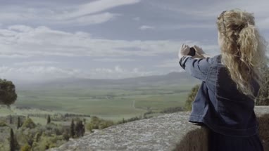 Tourist taking photo of view
