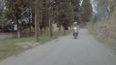 Young couple riding on scooter 