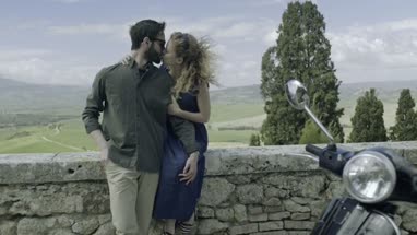 Couple with scooter taking selfie