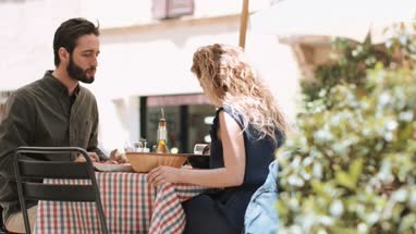 Young couple eating alfresco