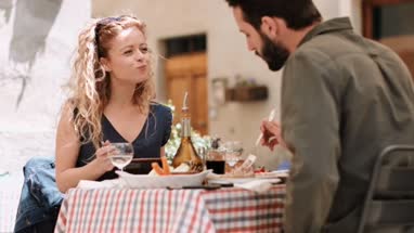 Young couple eating alfresco