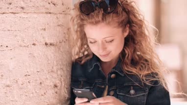 Solo traveller messaging on vacation