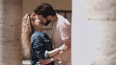 Young tourists kissing on vacation