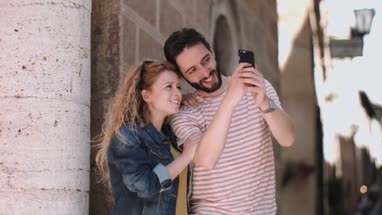 Young tourists taking photos on vacation